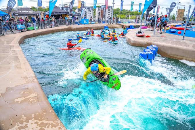 Kayakers on the rapids course at Cardiff International White Water